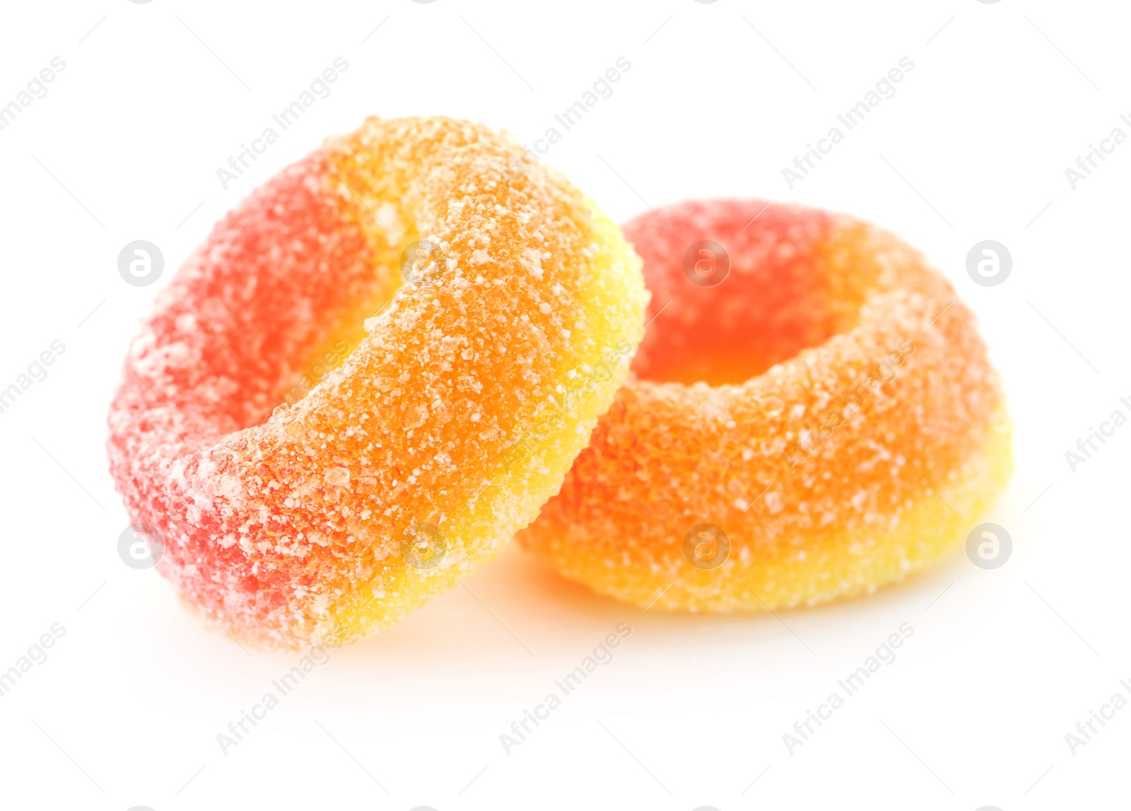 Photo of Bright delicious jelly candies on white background