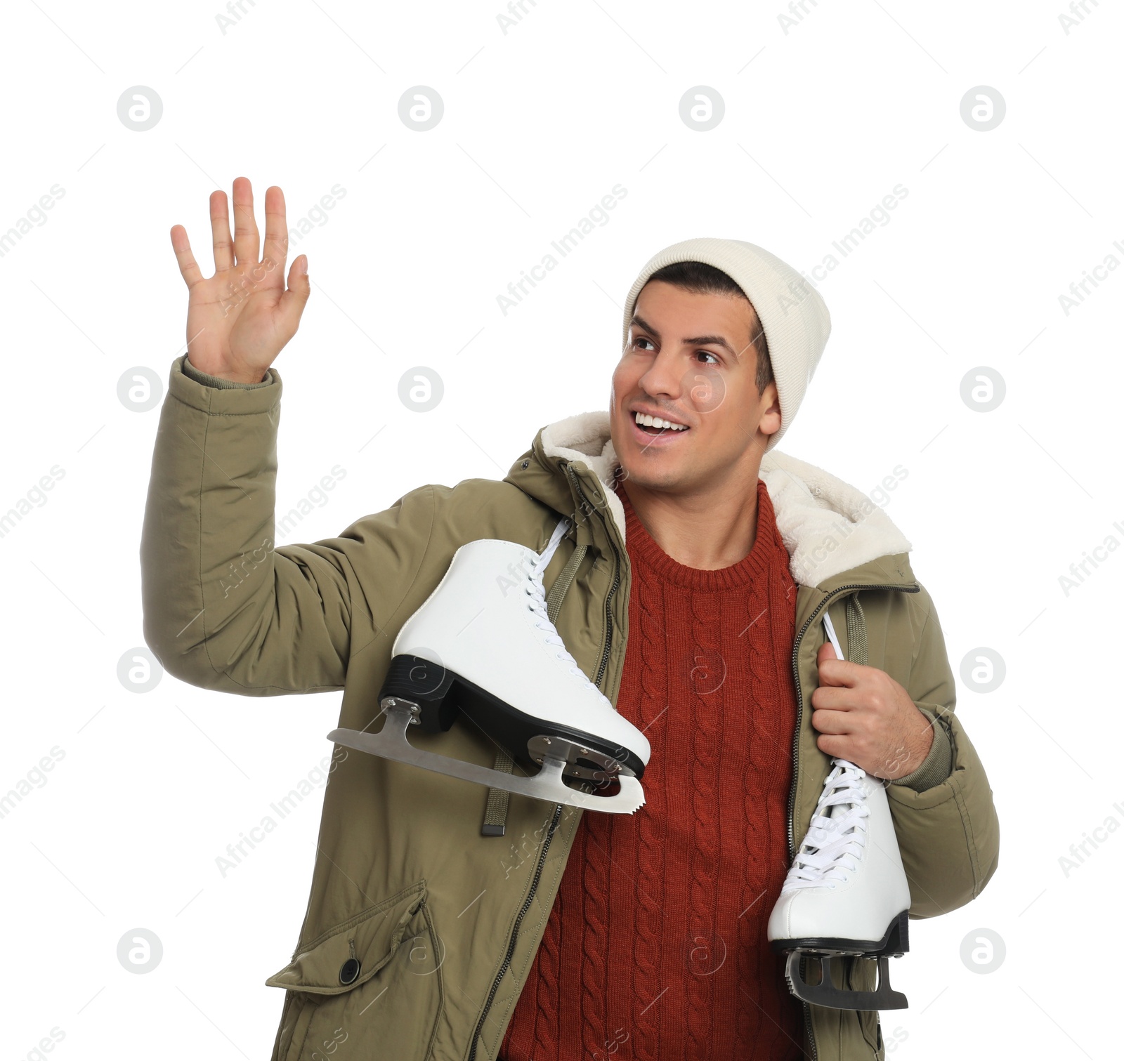 Photo of Happy man with ice skates on white background