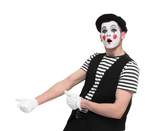 Funny mime artist in beret posing on white background