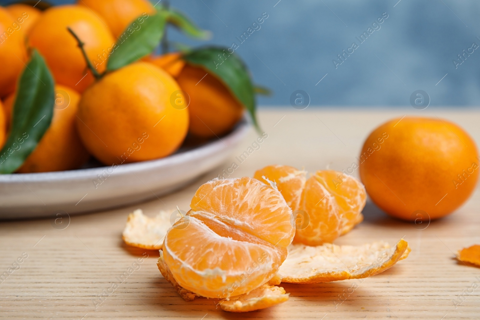 Photo of Fresh ripe tangerines on table. Citrus fruit