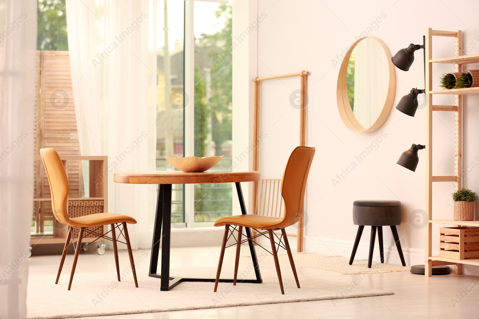 Photo of Modern dining room interior with table and chairs