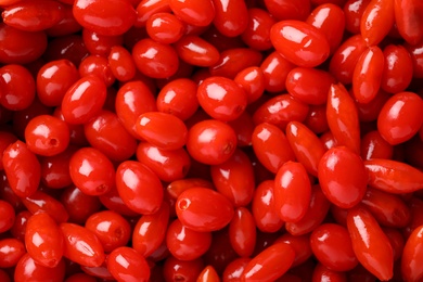 Photo of Fresh ripe goji berries as background, top view