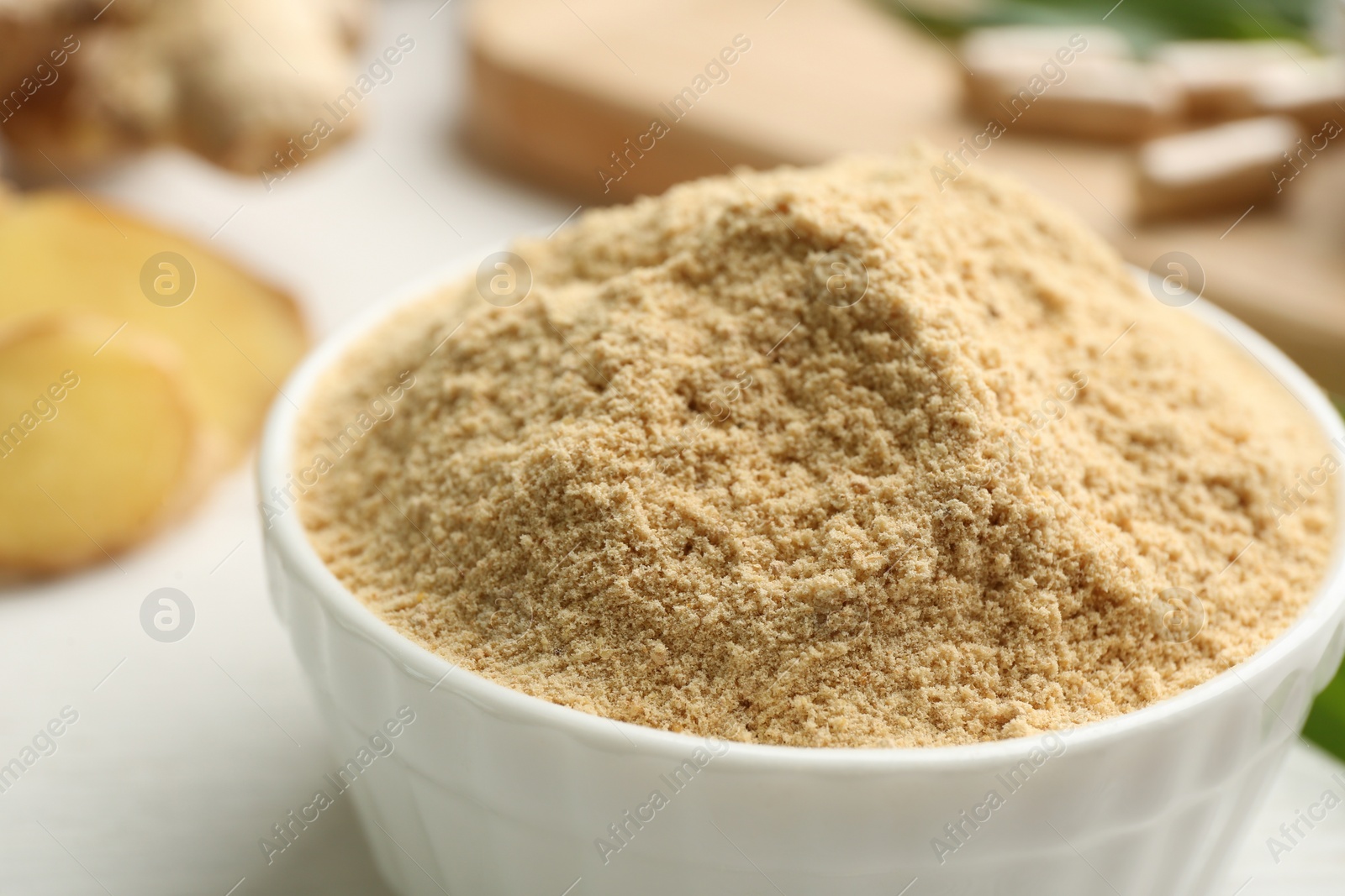 Photo of Dry powdered ginger in bowl, closeup view