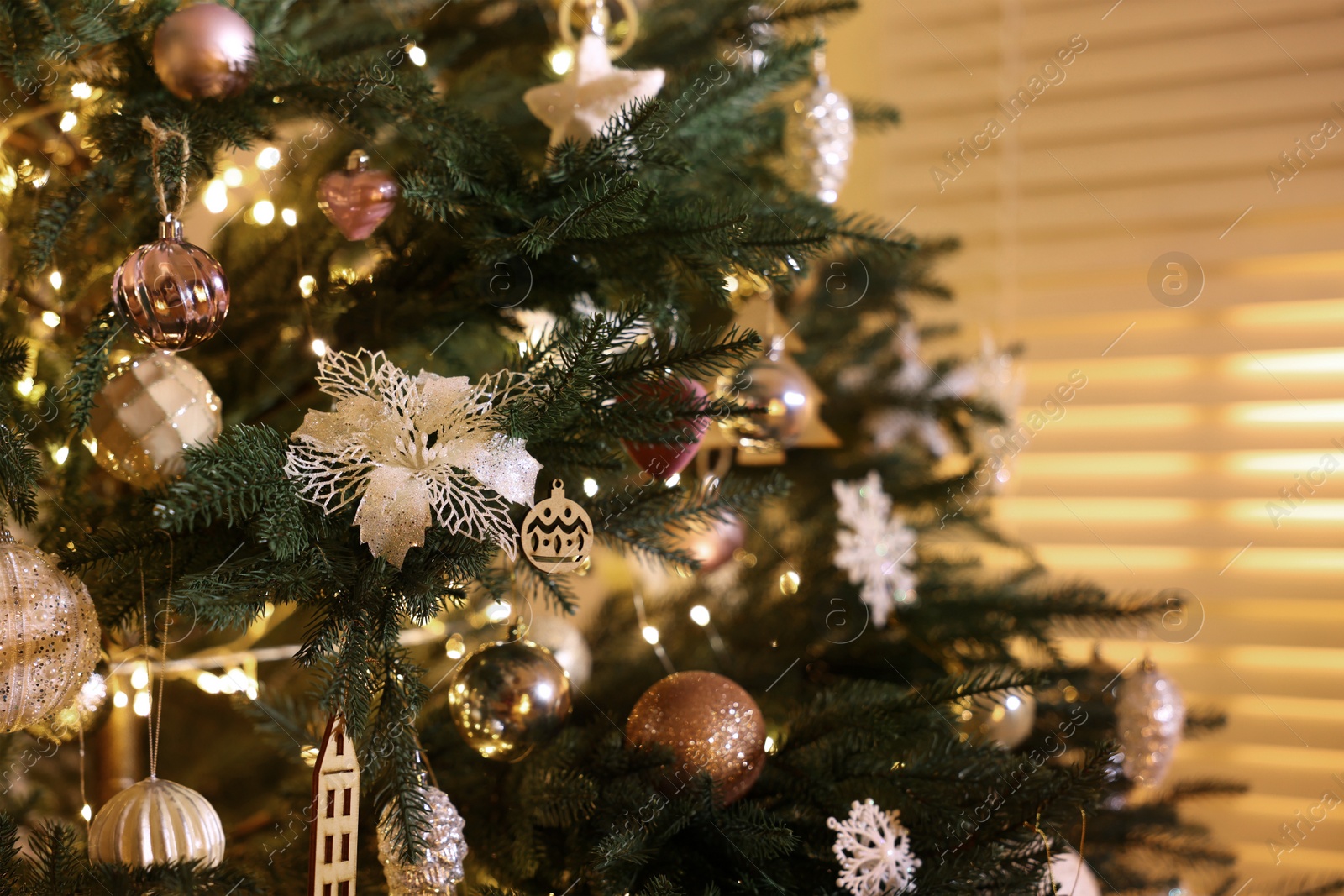 Photo of Closeup view of Christmas tree with beautiful decor