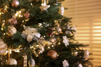 Closeup view of Christmas tree with beautiful decor