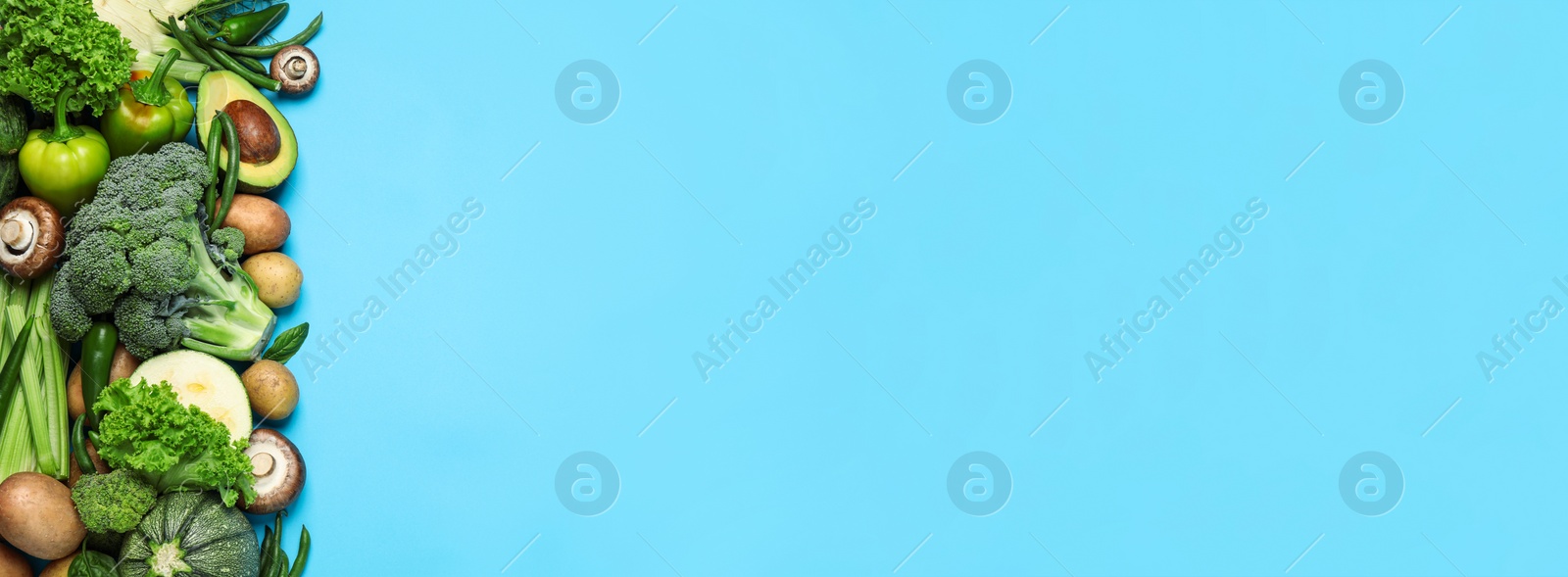 Image of Many fresh different vegetables on light blue background, top view with space for text. Banner design 