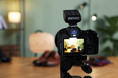 Beauty blogger's workplace. Men's accessories on table indoors, focus on camera