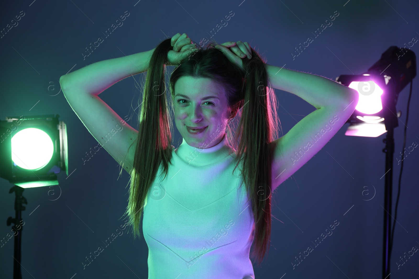 Photo of Portrait of beautiful young woman in photo studio