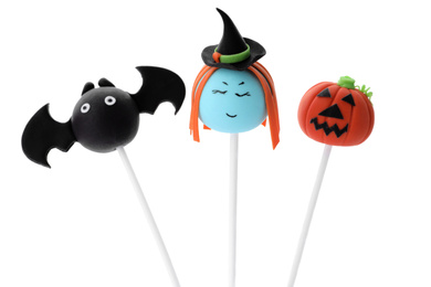 Delicious Halloween themed cake pops on white background