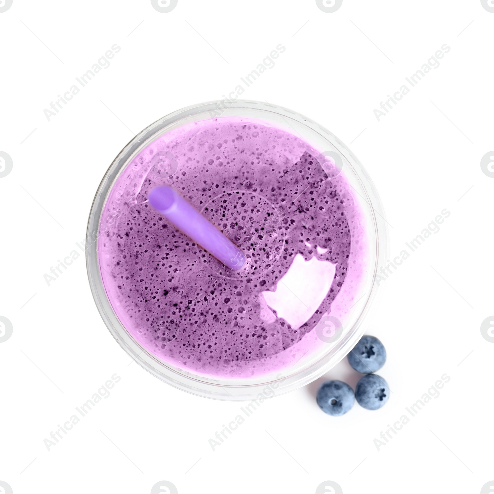 Photo of Tasty blueberry smoothie in plastic cup on white background, top view