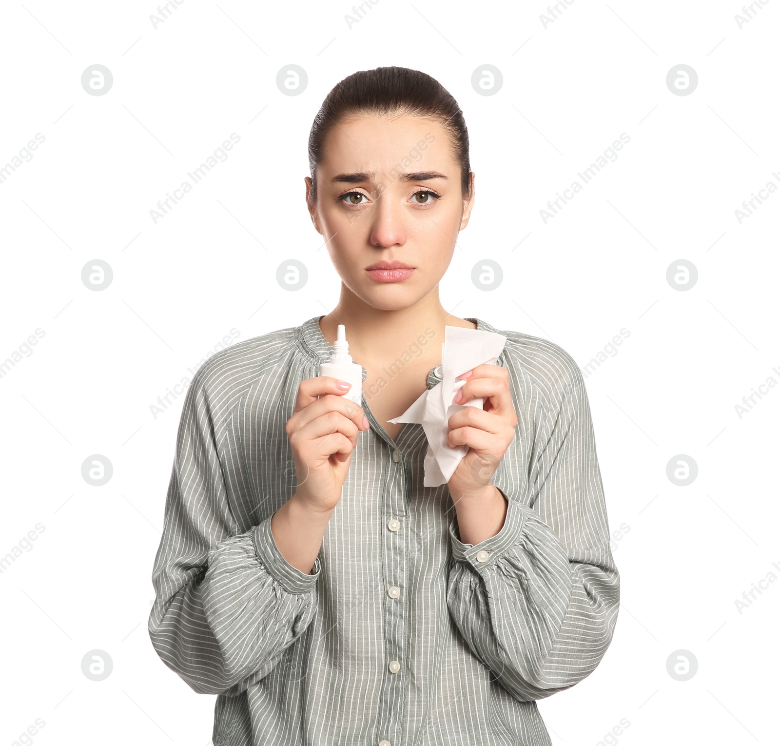 Photo of Woman with nasal spray and tissue on white background