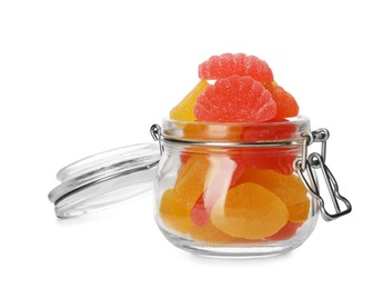 Many jelly candies in glass jar isolated on white
