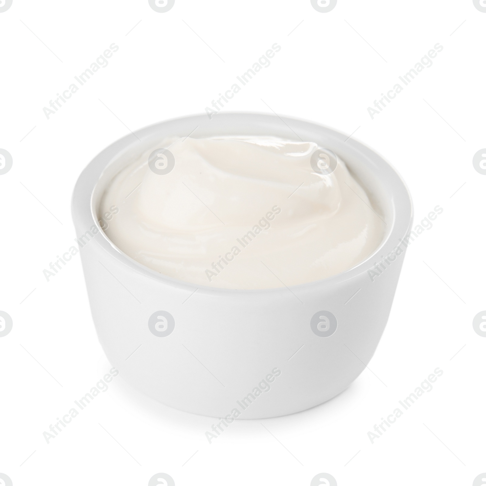 Photo of Bowl with sour cream on white background