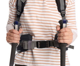 Photo of Female hiker with backpack and trekking poles on white background, closeup
