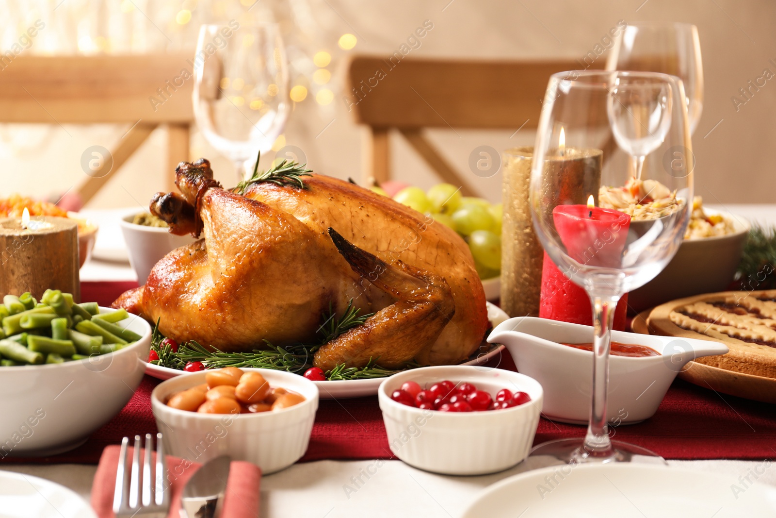 Photo of Traditional festive dinner with delicious roasted turkey served on table