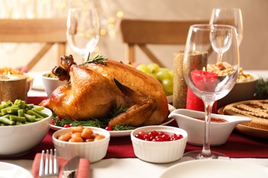 Traditional festive dinner with delicious roasted turkey served on table