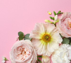 Photo of Flat lay composition with different beautiful flowers on pink background. Space for text