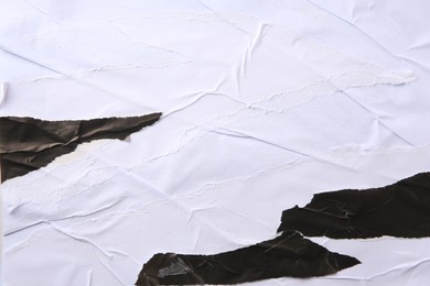 Photo of Texture of white and black ripped paper posters, closeup