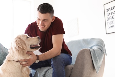 Portrait of owner with his friendly dog at home