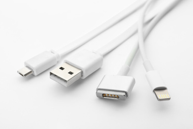 Photo of Charge cables on white background. Modern technology