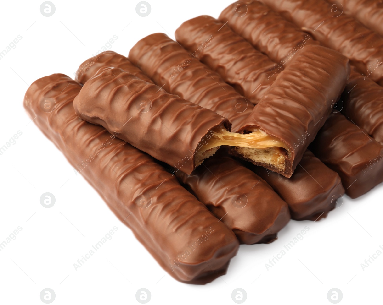 Photo of Sweet tasty chocolate bars with caramel on white background