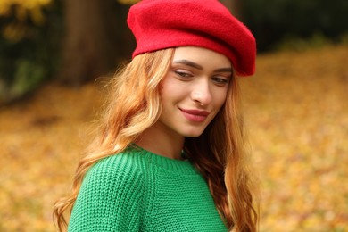Portrait of beautiful woman wearing autumn sweater outdoors
