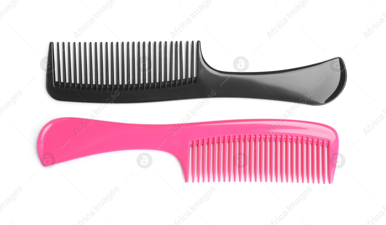 Photo of Modern hair combs isolated on white, top view