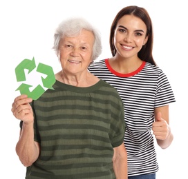 Photo of Elderly woman and her granddaughter with recycling symbols on white background