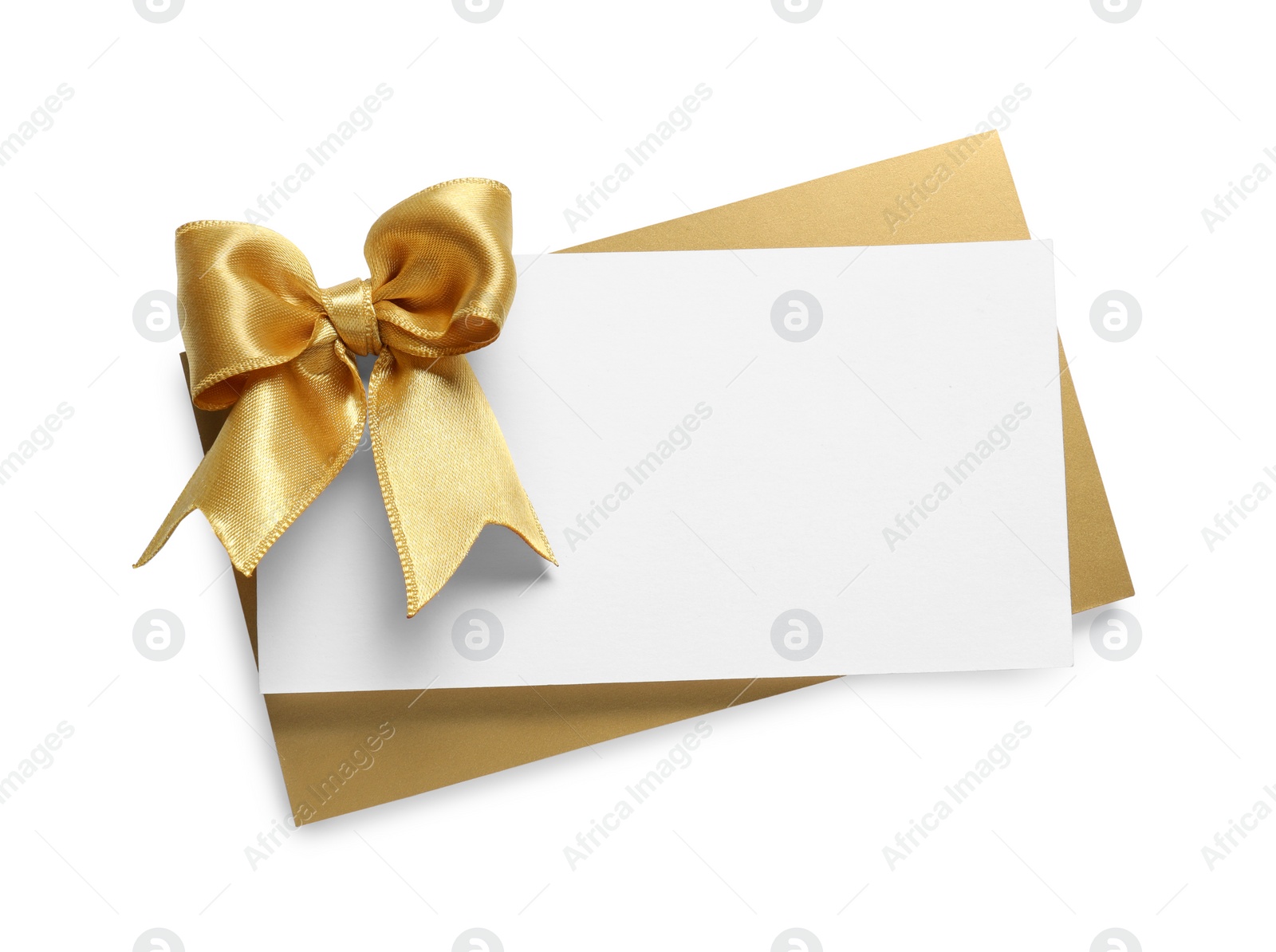 Photo of Blank gift card with golden bow isolated on white, top view