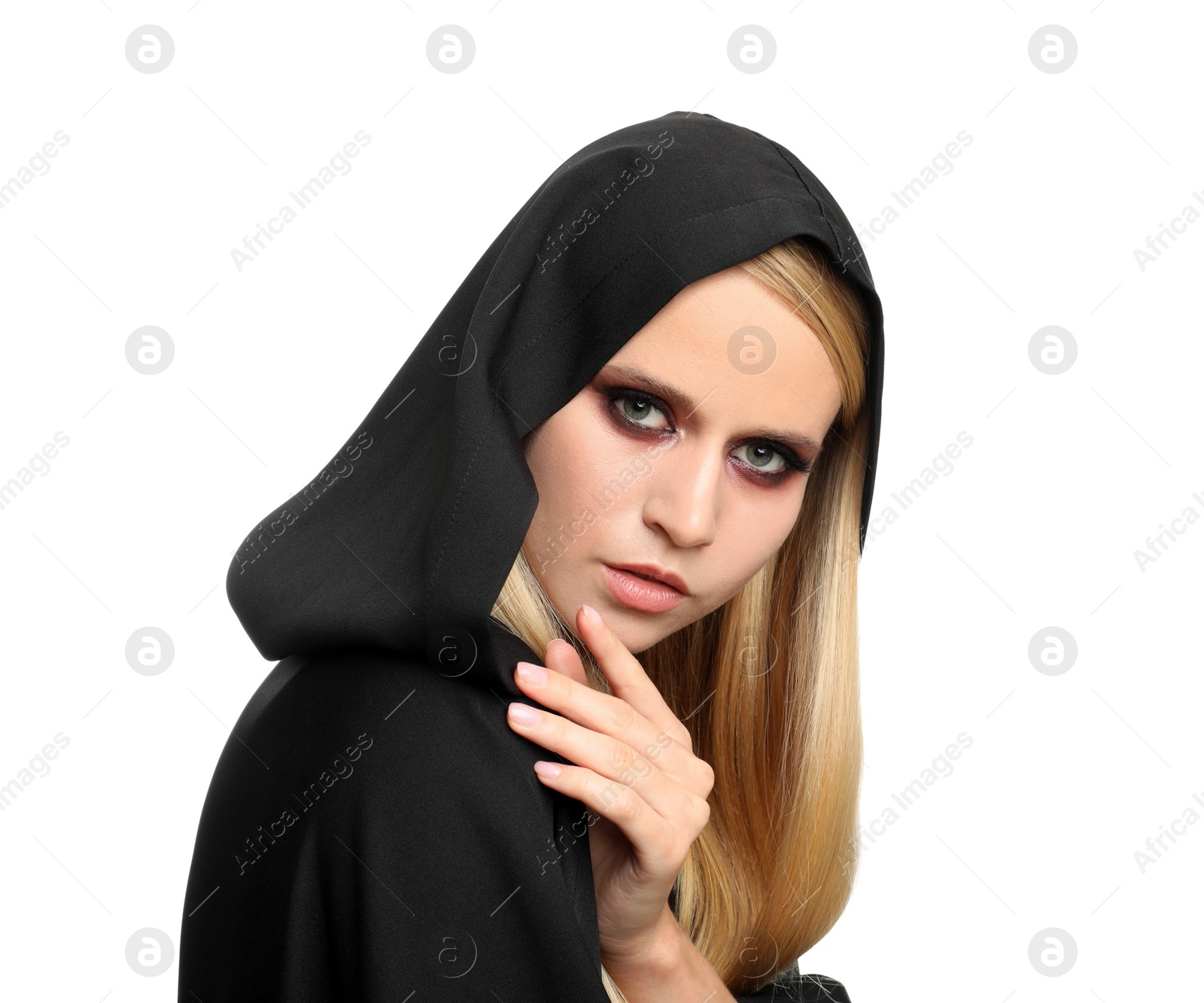 Photo of Witch in black mantle isolated on white. Scary fantasy character