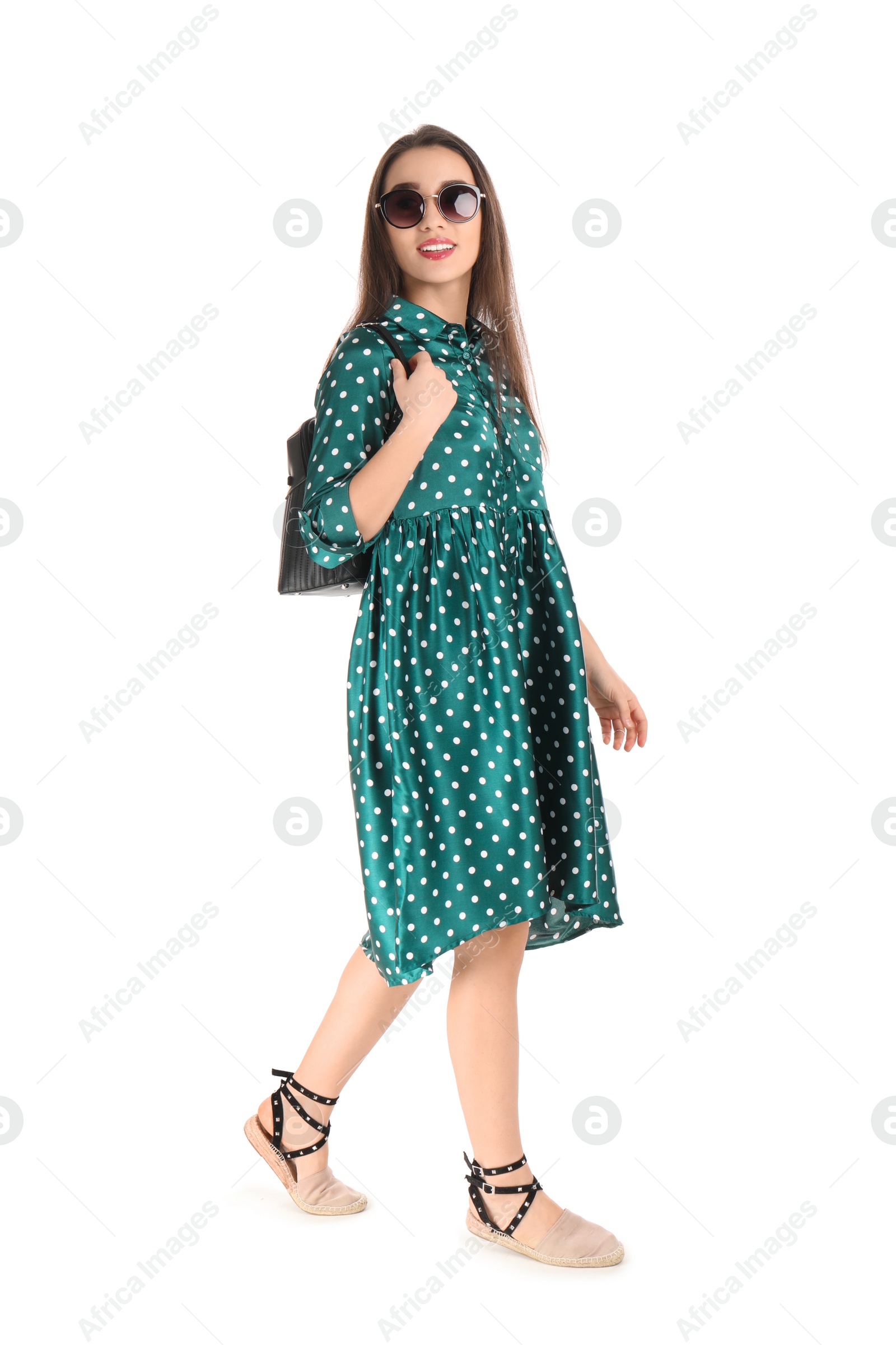 Photo of Portrait of beautiful young woman in stylish dress on white background