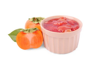 Photo of Bowl of tasty persimmon jam with fresh fruits on white background