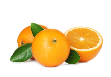 Photo of Fresh ripe oranges with leaves isolated on white