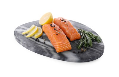 Photo of Pieces of fresh raw salmon, spices and lemon slices isolated on white