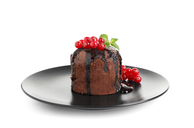Delicious warm chocolate lava cake with mint and berries isolated on white