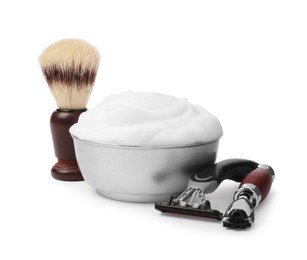 Shaving brush, foam and razors on white background