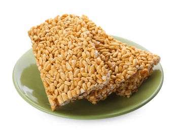 Plate with puffed rice bars (kozinaki) on white background