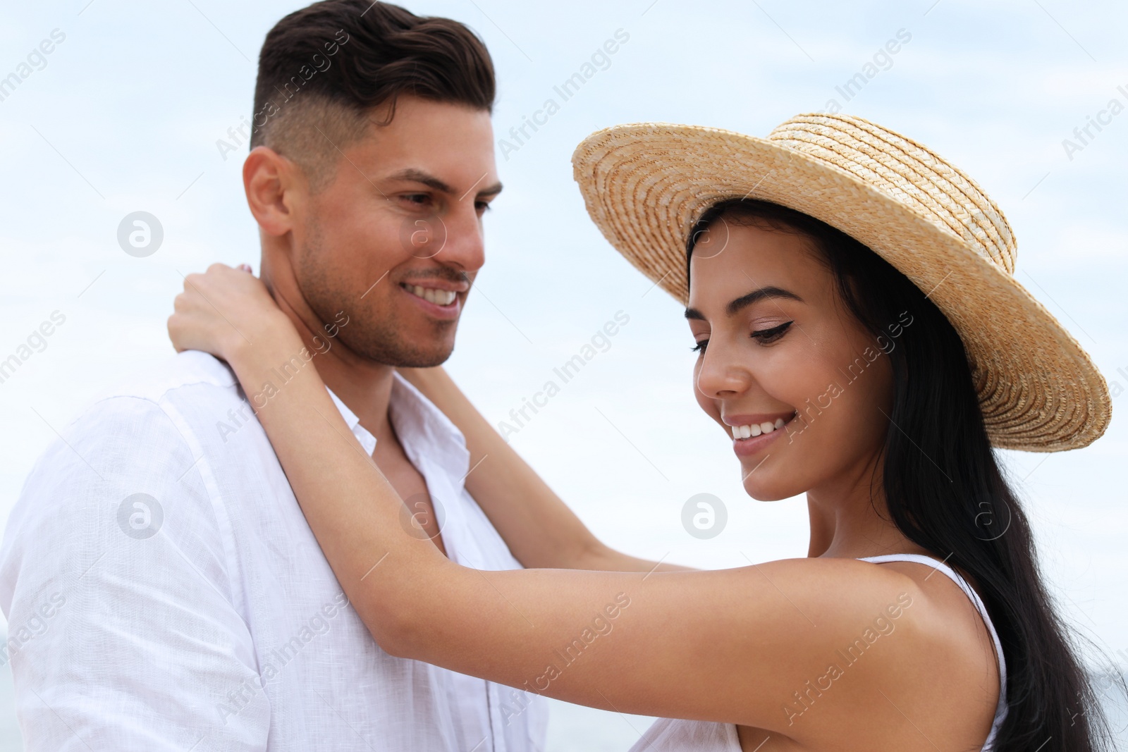 Photo of Lovely couple spending time together near sea