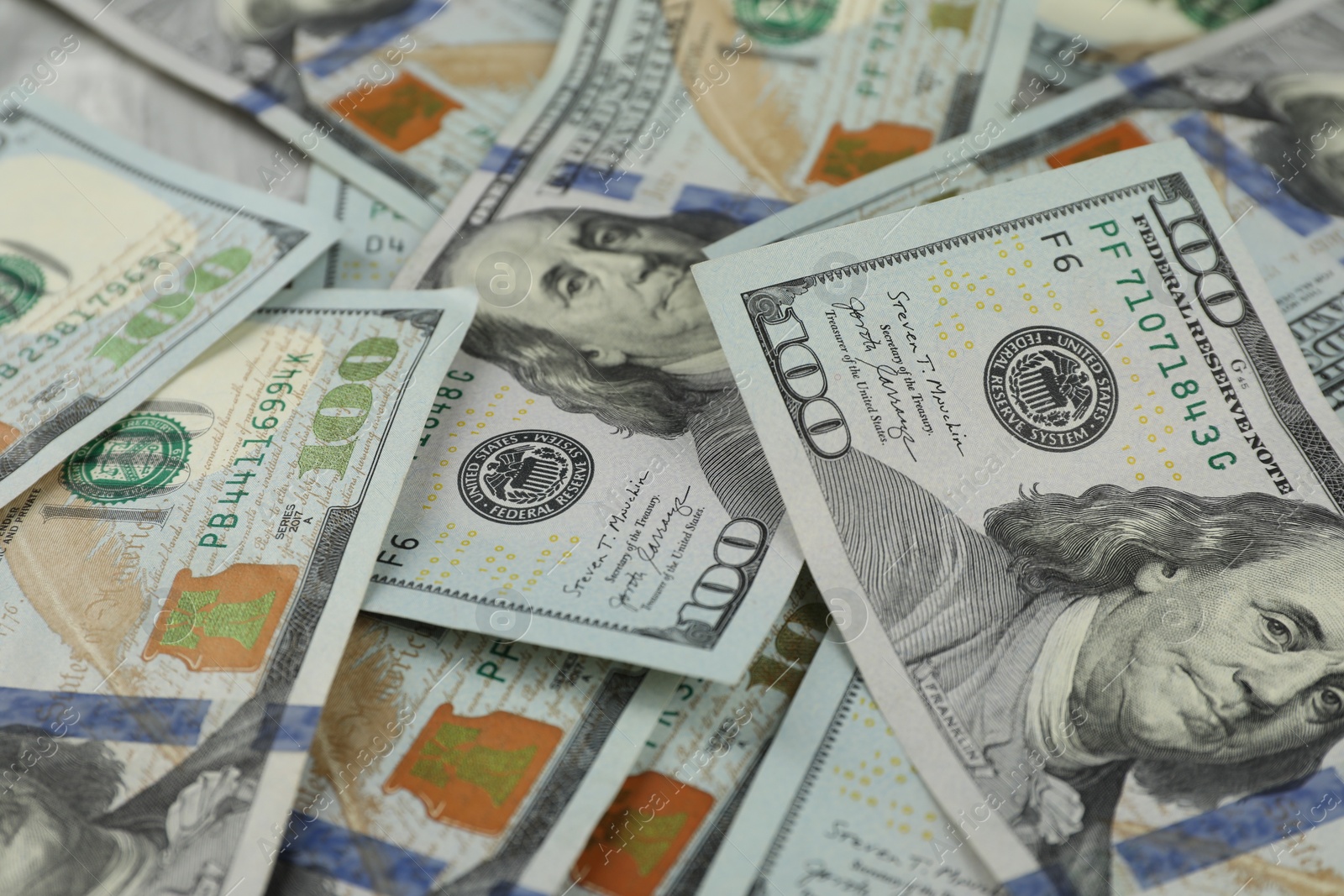 Photo of Money exchange. Dollar banknotes as background, closeup