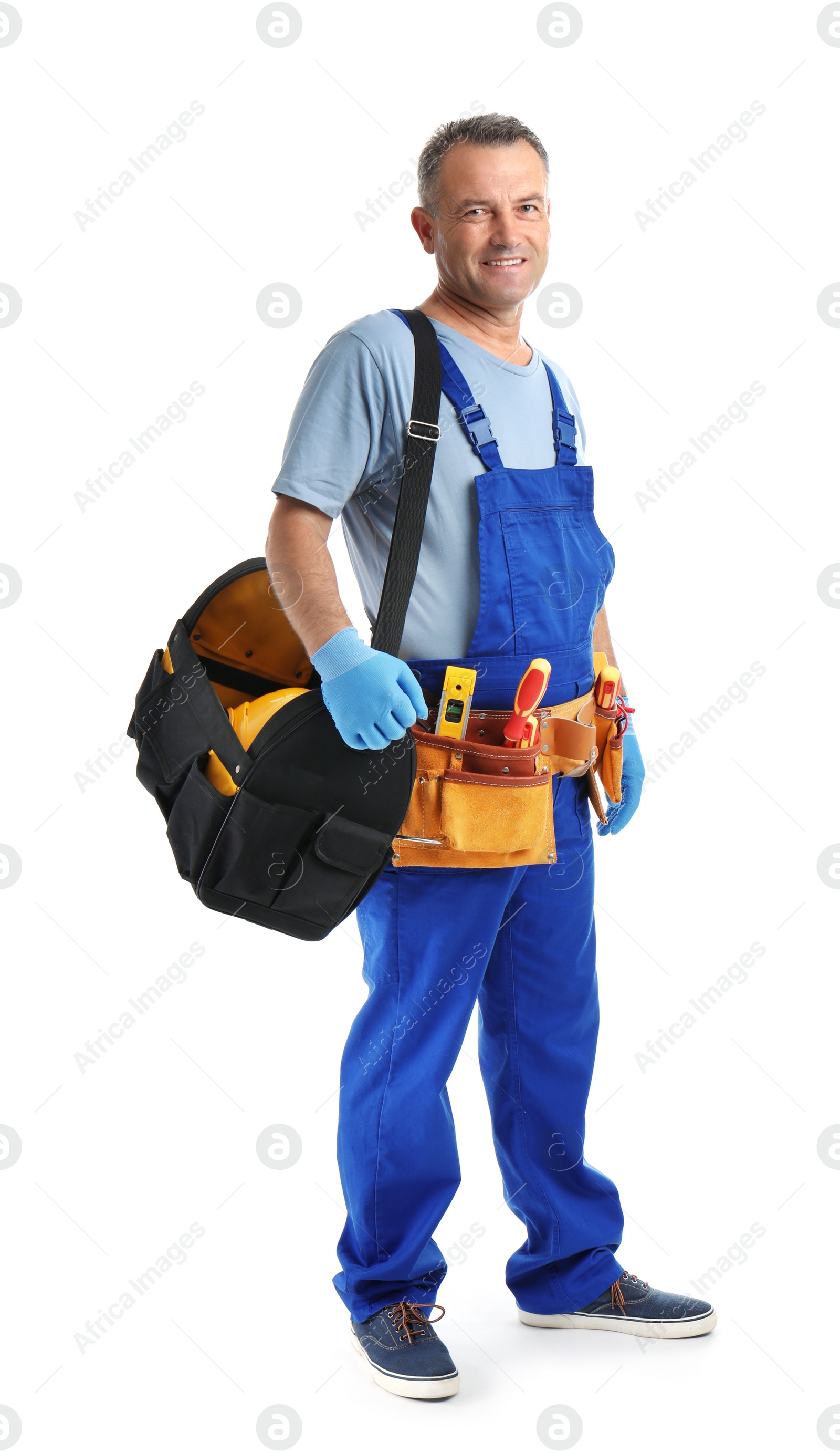 Photo of Electrician with tools wearing uniform on white background