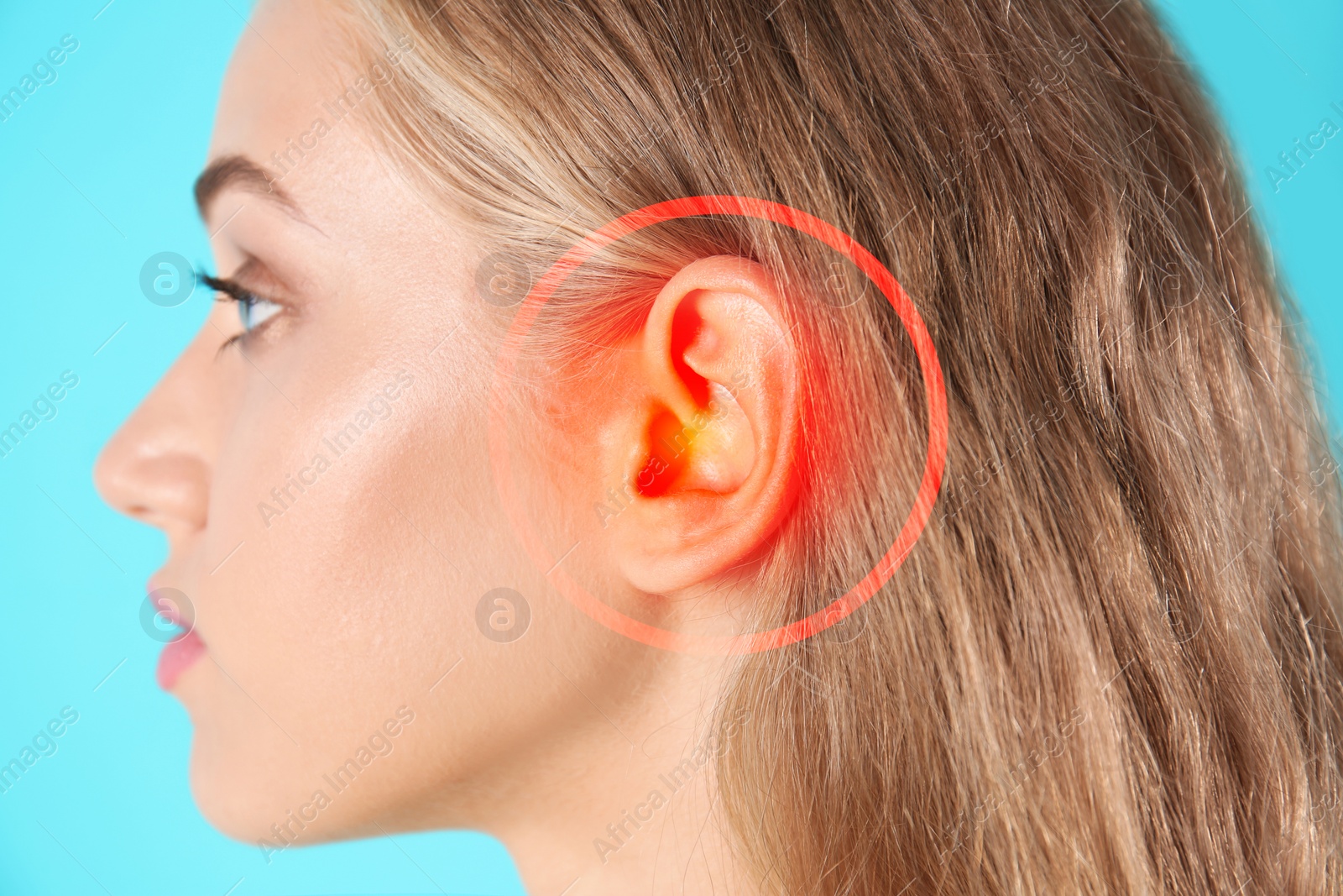 Image of Young woman with hearing problem on turquoise background, closeup