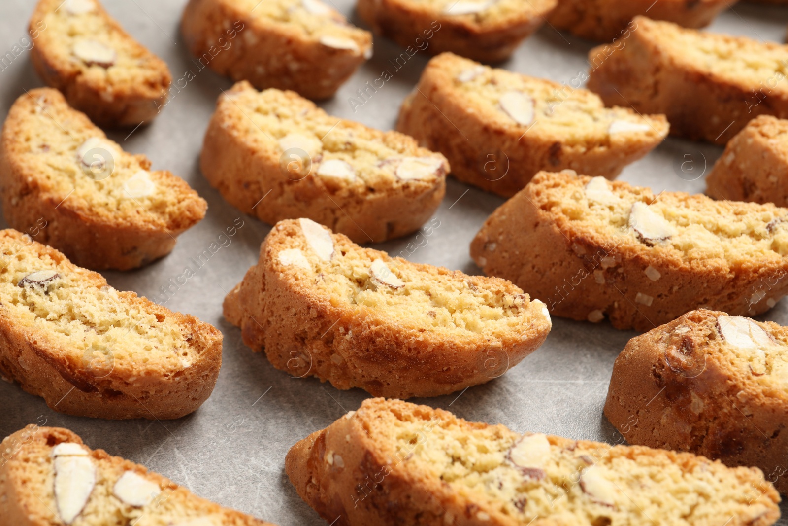 Photo of Traditional Italian almond biscuits (Cantucci) on light table, closeup