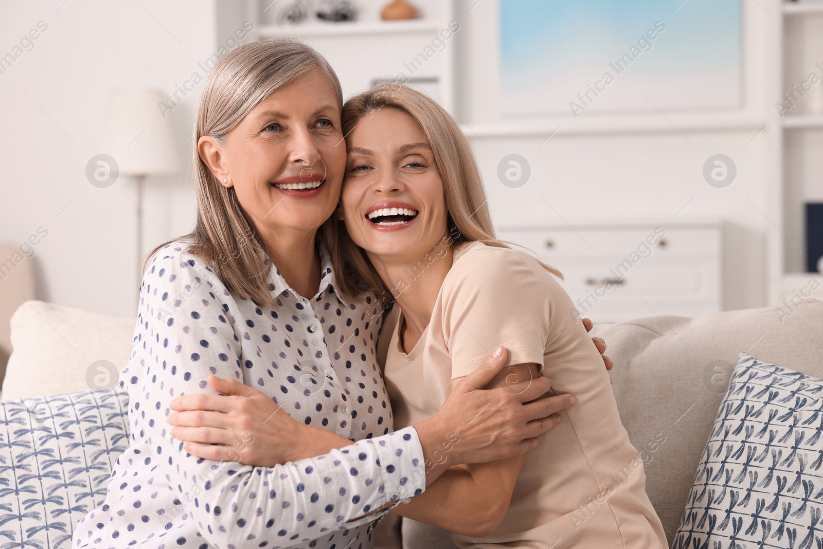 Photo of Happy mature mother and her daughter at home