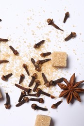 Different spices on white table, flat lay