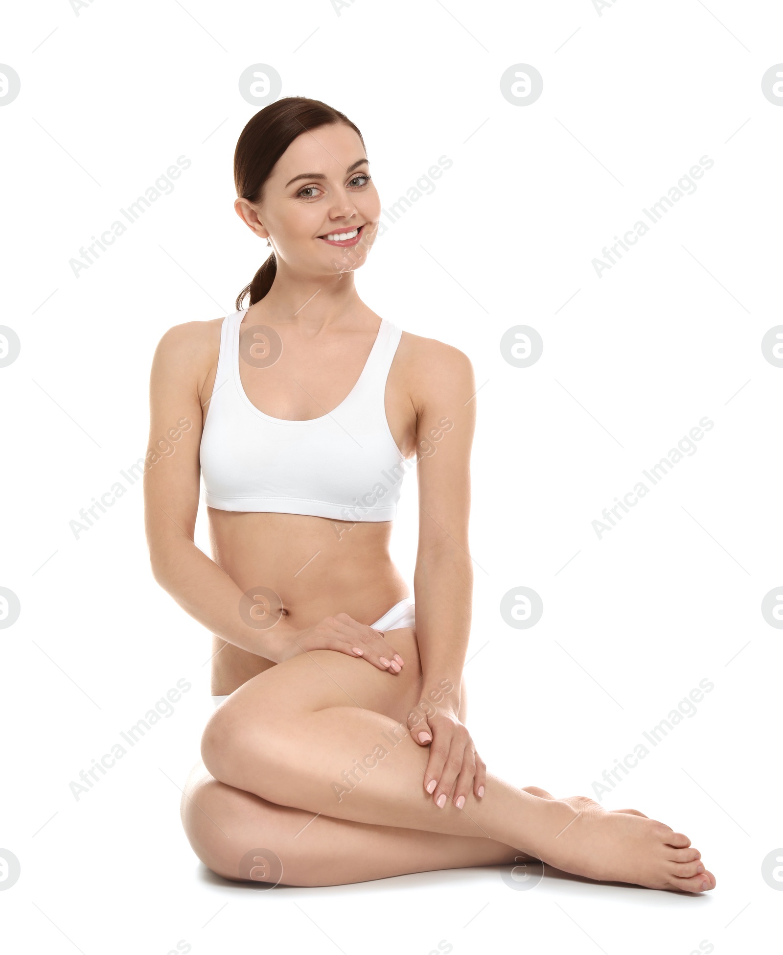 Photo of Young woman showing smooth silky skin after epilation on white background