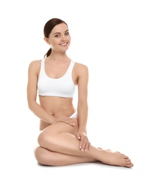 Young woman showing smooth silky skin after epilation on white background