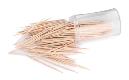 Wooden toothpicks and holder on white background, top view