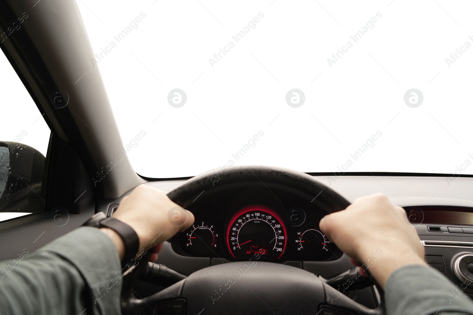 Photo of Man driving car with speedometer on dashboard, closeup