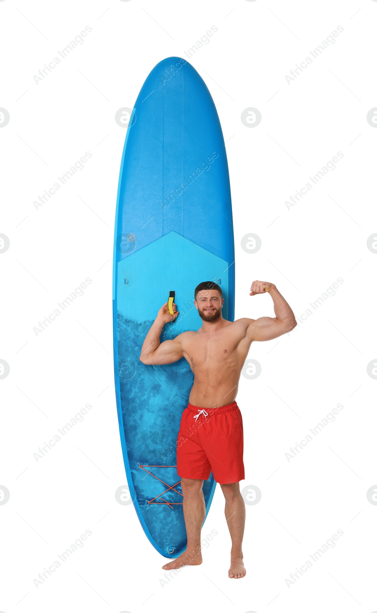 Photo of Handsome man with blue SUP board on white background