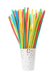 Paper cup with many colorful cocktail straws on white background